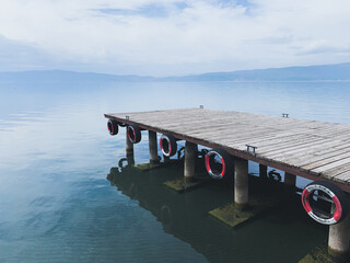 Empty wooden pier at the mountains lake