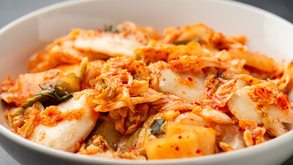 Traditional Korean Kimchi Cabbage in white bowl. Healthy food.
