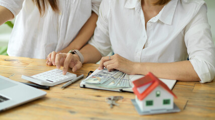 A real estate agent calculates the buyer's down payment