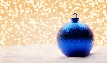 Glitter blue Christmas ball on snow