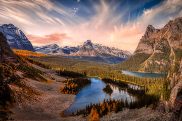 Scenic View of Glacier Lake with Canadian Rocky Mountains in Background. Dramatic Fall Sunset Sky...
