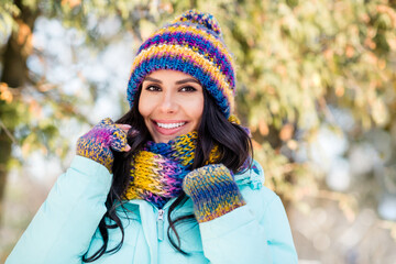 Photo of positive charming lady shiny white smile wear knitted mittens hat scarf coat in park outdoors