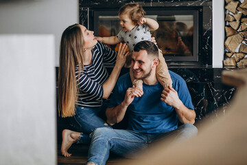 Young family with their little son at home