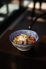 Japanese kumamoto shio ramen with horse meat on restaurant table