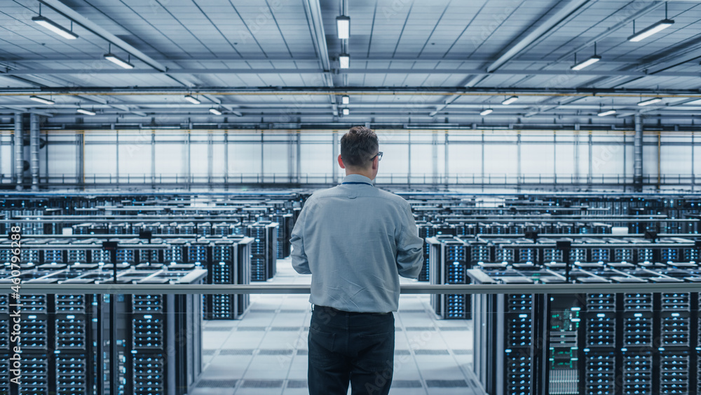 Poster Data Center Engineer Using Laptop Computer. Server Farm Cloud Computing Specialist Facility with Adult Male System Administrator Working with Data Protection Network for Cyber Security.