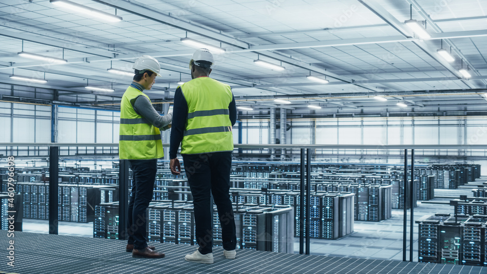 Aufkleber korean data center system administrators and african american it specialists in high visibility vest
