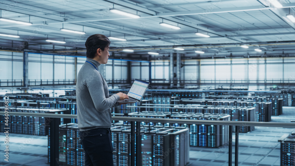 Aufkleber Data Center Engineer Using Laptop Computer. Server Farm Cloud Computing Specialist Facility with Adult Male System Administrator Working with Data Protection Network for Cyber Security.