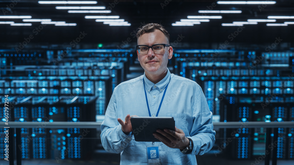 Poster Portrait of a Data Center Engineer Using Laptop Computer. Server Room Specialist Facility with Adult Male System Administrator Working with Data Protection Network for Cyber Security.