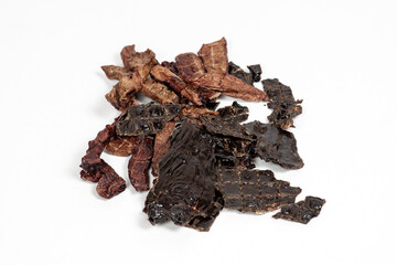 The pile of dehydrated beef products for dogs, cutt lungs and liver. Homemade pet treats. White...