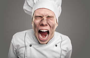 Funny screaming chef with dirty face
