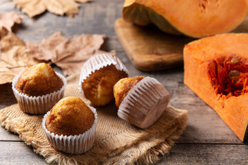 Pumpkin muffins on wooden table	