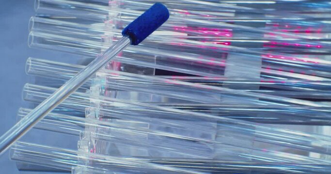 glass drum stick plays on a glass xylophone.close-up.