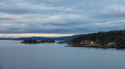 Fototapeta premium Gulf Islands on the West Coast of Pacific Ocean. Canadian Nature Landscape Background. Summer Sunrise. Near Vancouver Island, British Columbia, Canada.