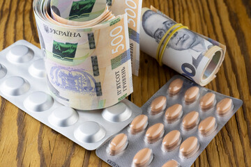 Image of pills and money close up