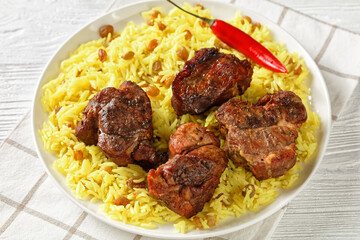 roasted meat served with raisins saffron rice