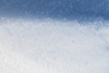 Obraz premium Close-up of fresh snowy land in the winter, viewed from above. Abstract full frame textured background. Copy space. Top view.