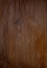 Close-up of an old, weathered and aged brown wood board. Abstract full frame textured background.