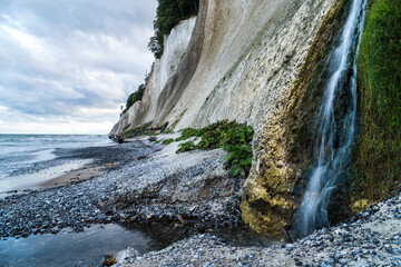 Waterfall at the chalk cliff coast of Jasmund National Park on the German island Ruegen