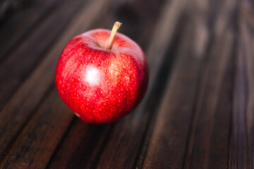 red apple on wooden background	

