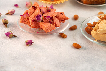 Close up of colorful Turkish halva sweets on gray surface