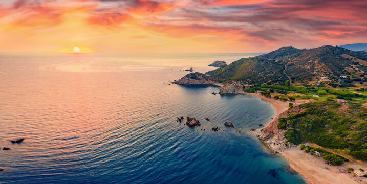 View from flying drone of Cheromylos beach with endless horizon. Spectacular summer sunrise on Euboea island, Greece. Fantastic Aegean seascape. Beauty of nature concept background.