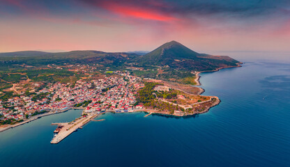 Fototapeta premium View from flying drone of Pylos Castle. Captivating summer cityscape of Pylos, Greece, Europe. Incredible sunrise on Peloponnese peninsula. Traveling concept background.
