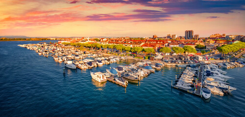 Superb summer sunset in Grado port, small town located between Venice and Trieste. Spectacular evening seascape of Adriatic sea. Traveling concept background.. © Andrew Mayovskyy