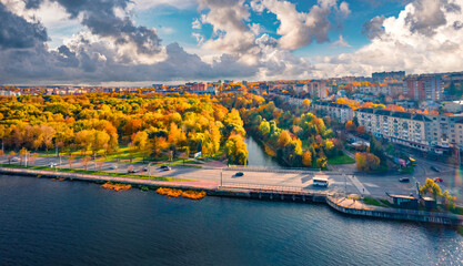 Dramatic autumn cityscape of Ternopil town, Ukraine, Europe. Spectacular morning view from flying drone of Ternopil lake. Traveling concept background.