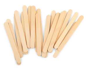 Disposable wooden spatulas for depilatory wax on white background, top view