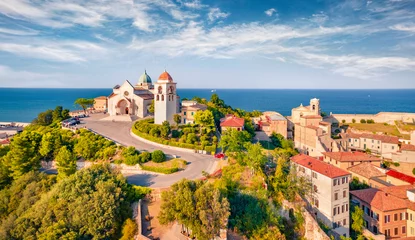 Fotobehang Blauwe hemel View from flying drone of Cattedrale di San Ciriaco church and San Gregorio Illuminatore - Catholic church. Spectacular summer cityscape of Ancona town, Italy, Europe. Traveling concept background.  © Andrew Mayovskyy