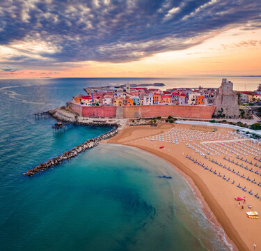 Fantastic summer view of Sant'Antonio beach. Colorful morning cityscape of Termoli port. Dramatic sunrise on Adriatic sea. Traveling concept background..