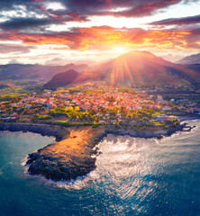Sunny morning view of scenic spot - Punta di Cirella. Spectacular summer cityscape of Cirella town,...