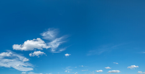 Obraz premium Deep blue sky and white different types of clouds in it. Beautiful nature background.