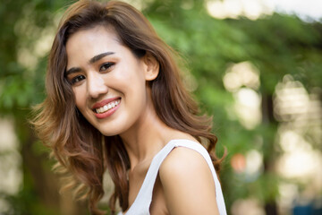 happy smiling woman in green nature