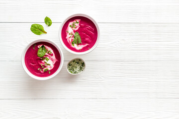 Cream soup made of red beet roots with basil