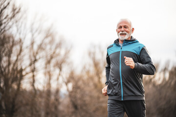 Active senior man is jogging. Healthy retirement lifestyle.