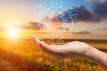 Zodiac signs inside of horoscope circle astrology and horoscopes concept on sky background