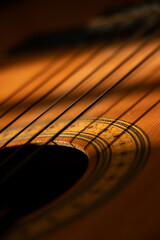 Fototapeta premium a different view of the strings and opening of the guitar sound