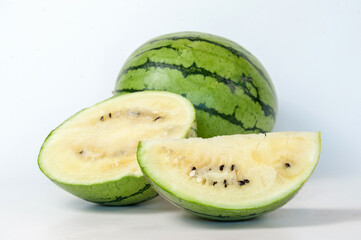 ripe watermelons on a white background and on melons