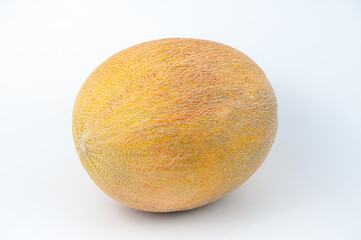 melons ripe on a white background and in the beds