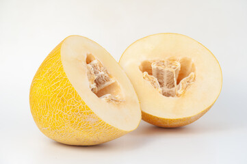 melons ripe on a white background and in the beds