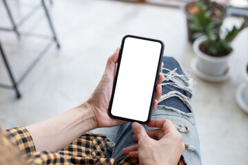 cell phone blank white screen mockup.hand holding texting using mobile on desk at office.background empty space for advertise.work people contact marketing business,technology