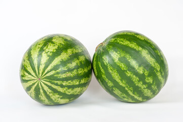 ripe watermelons on a white background and on melons
