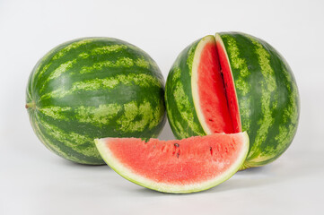 ripe watermelons on a white background and on melons