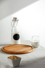 Milk on the table on a beautiful Christmas day, blank and shadow on the wall 