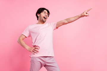Photo portrait man wearing t-shirt spectacles relaxing at party in summer dancing happy isolated pastel pink color background