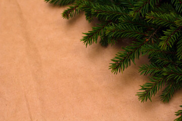 Craft christmas new year background with fir spruce branche. xmas card with copyspace