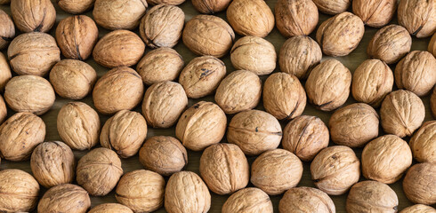 Background of  healthy walnuts in shell.