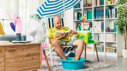Man spending his vacations at home and reading a book