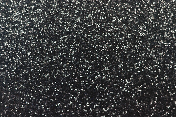Silver black sparkling glitter bokeh background, christmas abstract defocused texture